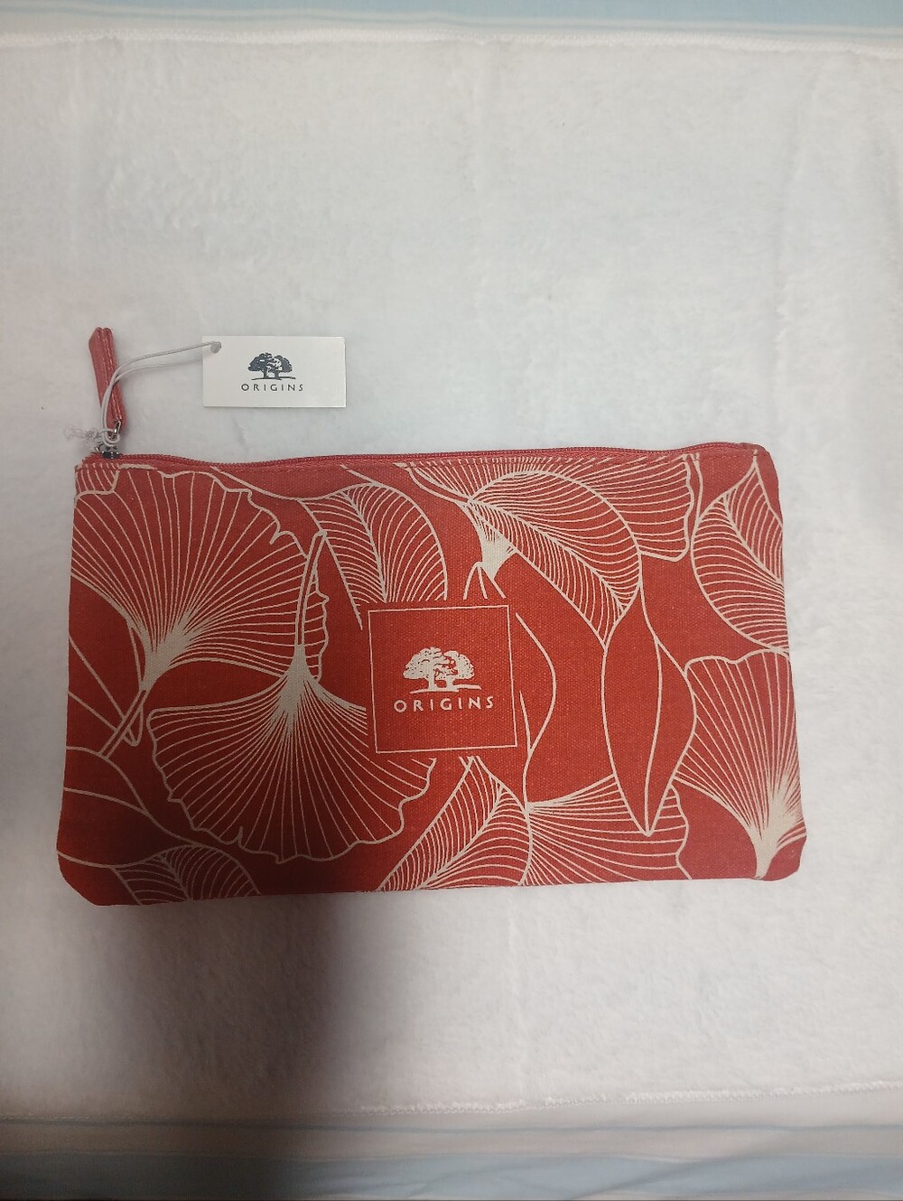 NWT ORIGINS ORANGE/RUST COLOR MAKEUP POUCH, 10" X 6";  SMOKE-FREE
